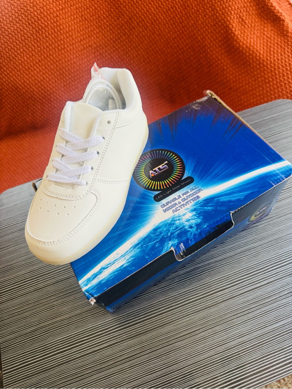 These are ATS branded unisex white LED sneakers lighting modes and USB charging.